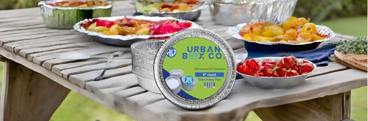 Urban Box Company biodegradable and recyclable aluminum food containers with fresh meals, eco-friendly packaging solution for restaurants and catering